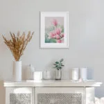 Pink Magnolias floral painting displayed in a modern living room, complementing neutral tones with its soft, pastel hues.