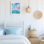 Blue Voyage watercolor sailboat painting in serene coastal bedroom, calming ocean wall art with summer sky and sea