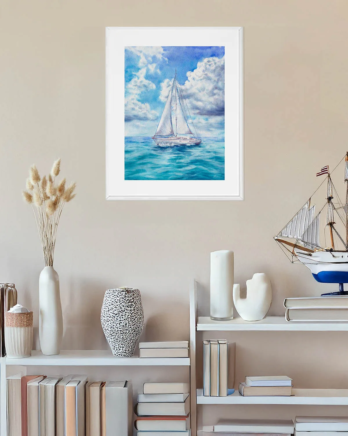 Framed sailboat painting in seaside-inspired living room, nautical watercolor artwork with clouds and ocean