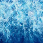 Liquid Energy – an abstract blue ocean watercolor painting on canvas featuring swirling sea waves, dynamic water movement, and foamy textures in deep blue tones, perfect for modern coastal interiors.