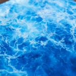 Blue abstract ocean watercolor painting "Liquid Energy" by Kateryna Nazarenko, original artwork on canvas with flowing sea waves and coastal energy.