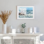 Framed Stormy Tide Rush ocean painting print hanging on a modern white wall with coastal decor