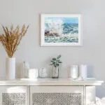 Framed Stormy Tide Rush ocean painting print hanging on a modern white wall with coastal decor