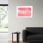 Above the sofa view of Ukrainian landscape watercolor "Pink Lakes of Ukraine," featuring rich pink saltwater and natural patterns — ideal for brightening modern neutral interiors.