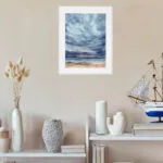 Ocean watercolor painting After Dark in contemporary entryway interior, coastal wall art with stormy clouds and twilight horizon for nautical themed home