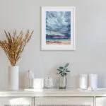 After Dark ocean watercolor artwork above the sofa in coastal living room, nautical wall art for beach house decor