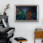 Kyiv. Podil. Blackout framed watercolor artwork hanging in a living room, featuring dramatic night city scene, glowing cobblestone reflections, and atmospheric architecture of Kyiv.