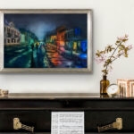 Framed Kyiv. Podil. Blackout watercolor painting displayed in a modern living room, showcasing elegant cityscape art with night lights, reflections, and historic architecture of Kyiv’s Podil district.