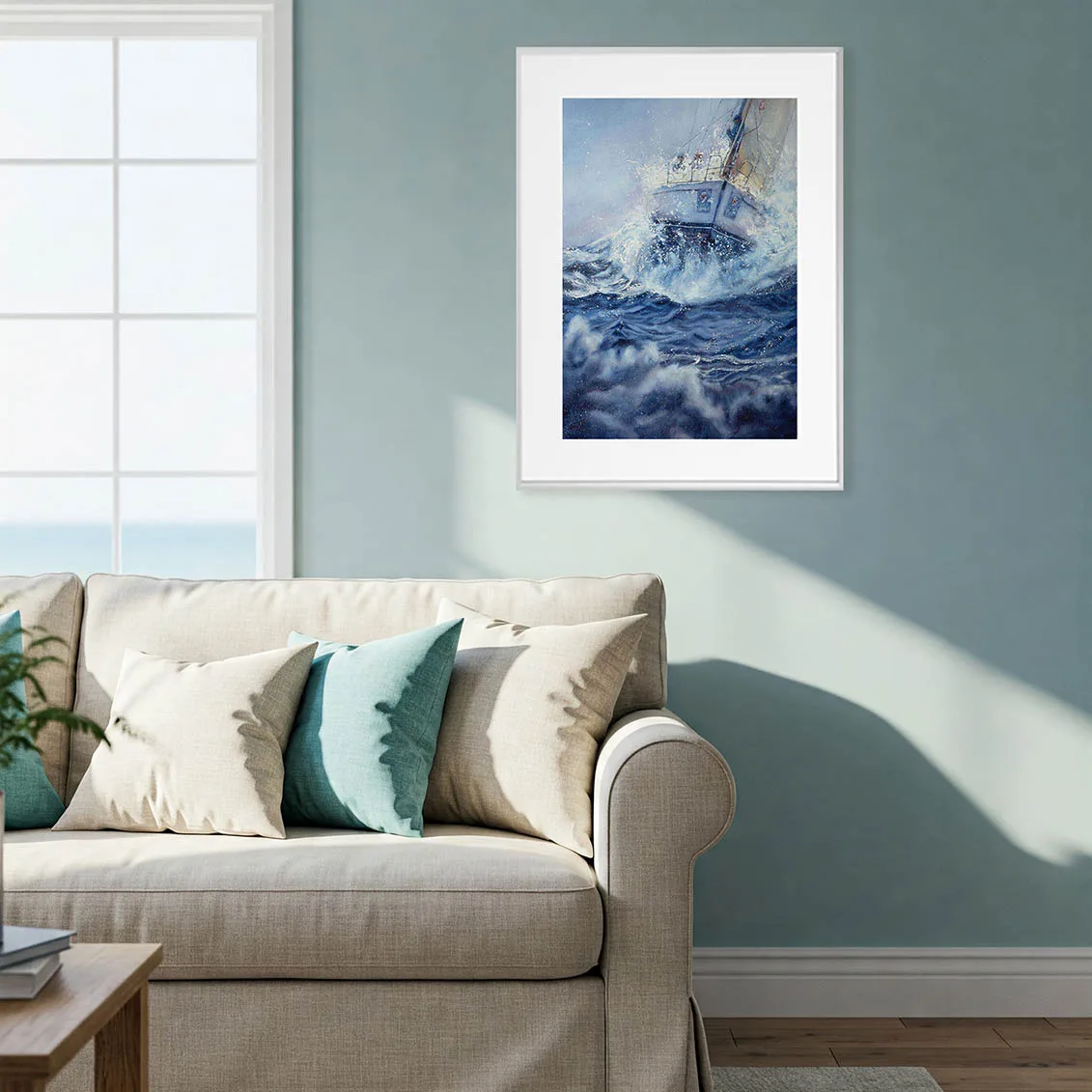 Bravery watercolor sailboat in stormy sea framed above the sofa in a contemporary living room, adding ocean-inspired wall art and dramatic marine motion to coastal home décor.