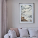Storm Anticipation original watercolor painting framed on a living room wall, adding moody coastal décor and serene ocean atmosphere.