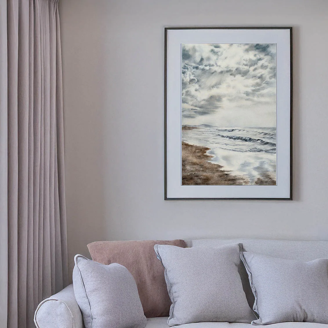 Storm Anticipation original watercolor painting framed on a living room wall, adding moody coastal décor and serene ocean atmosphere.