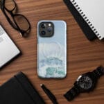 Turquoise blue wave ocean watercolor iPhone case with MagSafe on table