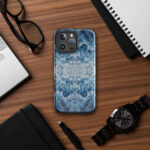 Deep blue ocean foam watercolor iPhone case with MagSafe on table