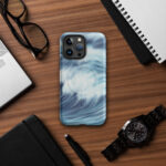 Blue ocean wave watercolor iPhone case with MagSafe on table