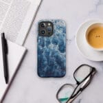 Blue and white ocean watercolor artwork printed on a MagSafe iPhone case