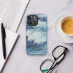 Blue and turquoise ocean wave watercolor artwork printed on a MagSafe iPhone case
